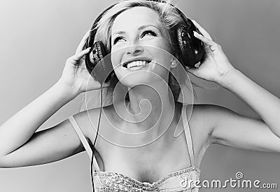Sexy blond model Listens to music