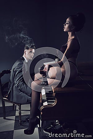 Sexy couple with piano