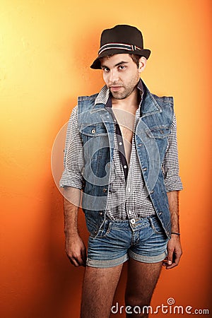 Sexy gay man in jeans and hat