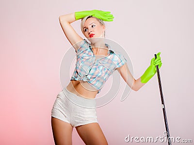 Sexy girl retro style, woman housewife cleaner with mop