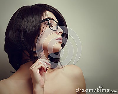 Sexy profile of thinking woman in glasses