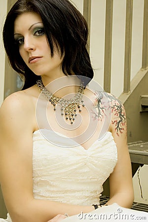Sexy tattoo woman in bridal dress