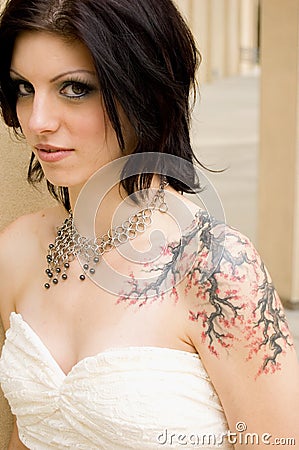 Sexy tattoo woman in bridal dress