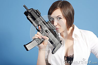 Sexy woman with assault gun