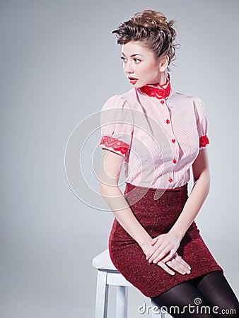 Sexy woman dressed retro doing a pin-up fashion shoot