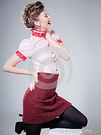 Sexy woman dressed retro doing a pin-up fashion shoot