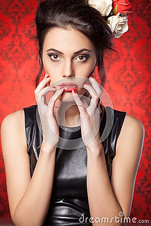 Sexy woman in leather jacket red vintage room