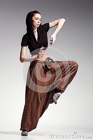 Sexy woman model posing in large (salwar) pants - fashion shot