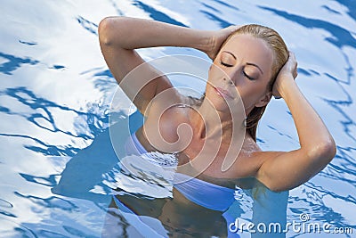 Sexy Woman Wearing White Bikini In Swimming Pool