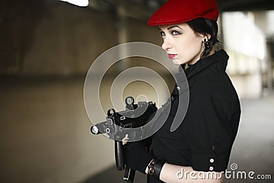 Sexy young woman with gun