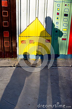 Shadow of father and child holding hands