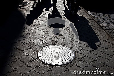 Shadows of people walking street i