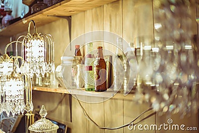 Shelf and crystal lamp in thrift store