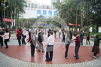 Shenzhen, China: citizens in jump square dance