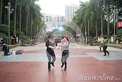 Shenzhen, China: citizens in jump square dance