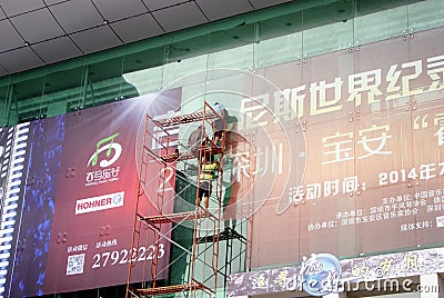 Shenzhen, China: installation of advertising signs