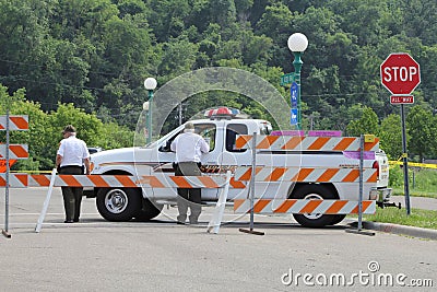 Sherriff Department standing patrol at road block at Harriet Island in Saint Paul, Minnesota during the Mississippi River flood.