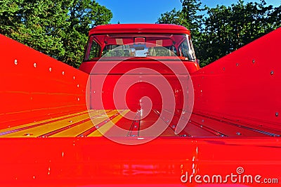 Shinny red and wood floor board truck bed