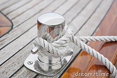 Ship Knotted Onto Pier With White Rope