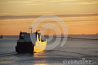 Ship sailing from Hoek van Holland at sunset