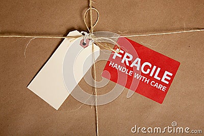 A Shipping box with a blank tag and a Fragile