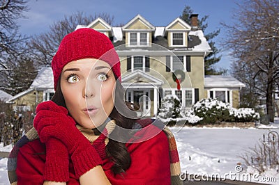 Shivering Mixed Race Woman in Winter Clothing Outside in Snow