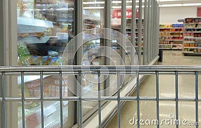 Shopping cart in frozen foods aisle