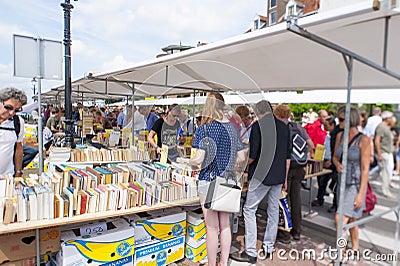 Shopping people at white market booth