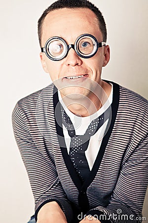 Shy nerd in funny glasses