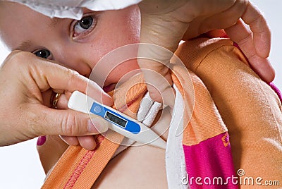 Sick child measuring fever