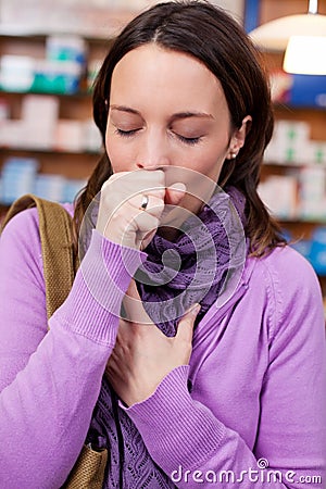 Sick Woman Coughing In Pharmacy