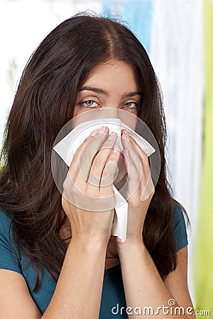Sick woman uses a handkerchief