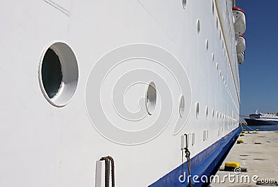 A side view of a Cruise ship and Portholes