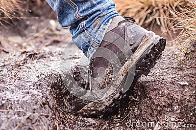 Side view of an hiking shoe covered in mud