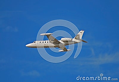 Side view of light white colored jet airplane