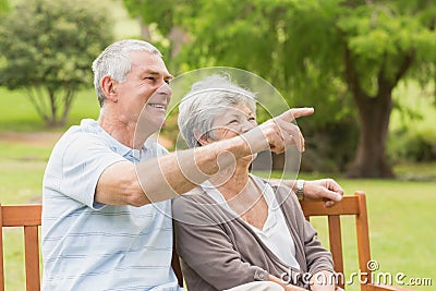 Side view of a senior couple at the park