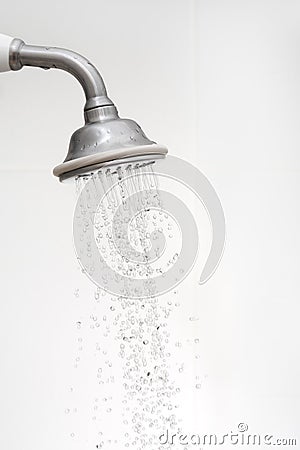 Side view of a shower head with running water