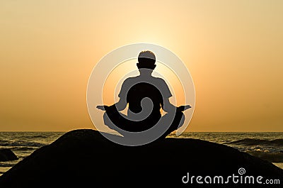 Silhouette of a beautiful Yoga man