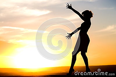 Silhouette of girl in dress