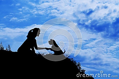 Silhouette of girl train a dog