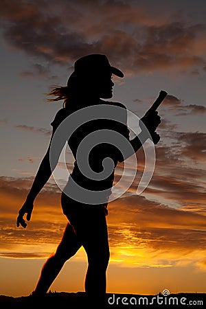 Silhouette gun woman walk