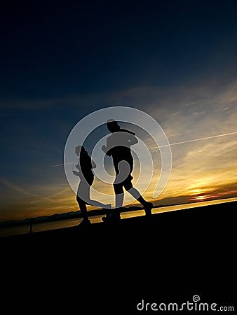Silhouette of a jogger in sunrise