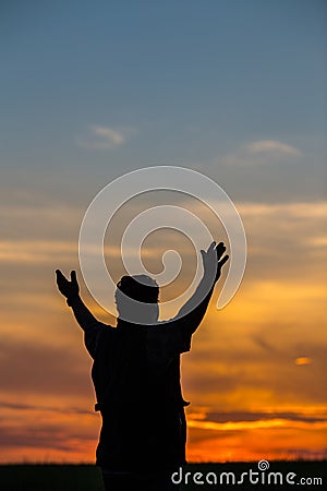 Silhouette of man standing in a field