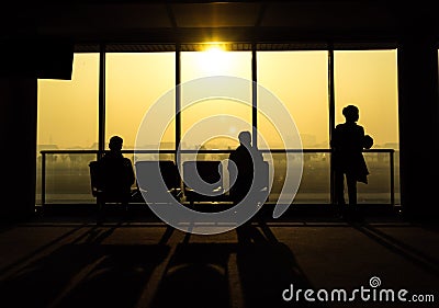 Silhouette of people waiting for departure from airport