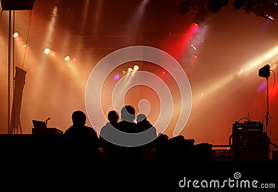 Silhouette of stage-crew and concert light