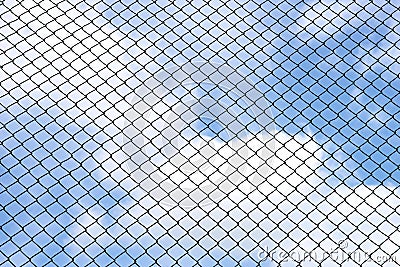 Silhouette wired fence with blur cloud and blue sky