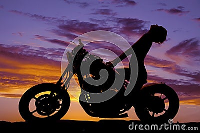 Silhouette woman motorcycle head way back