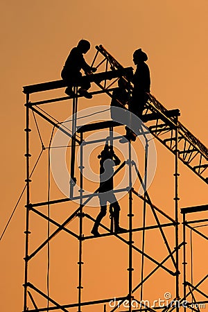 Silhouette of Workmen on assembling concert stage