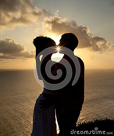 Silhouette of a young couple at sunset