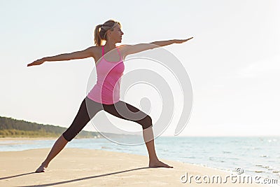 Silhouette of young healthy and fit woman practicing yoga